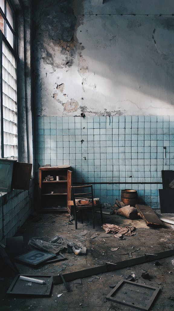 Explore the rustic charm of an abandoned room with worn furniture and scattered debris in Sankt-Peterburg.